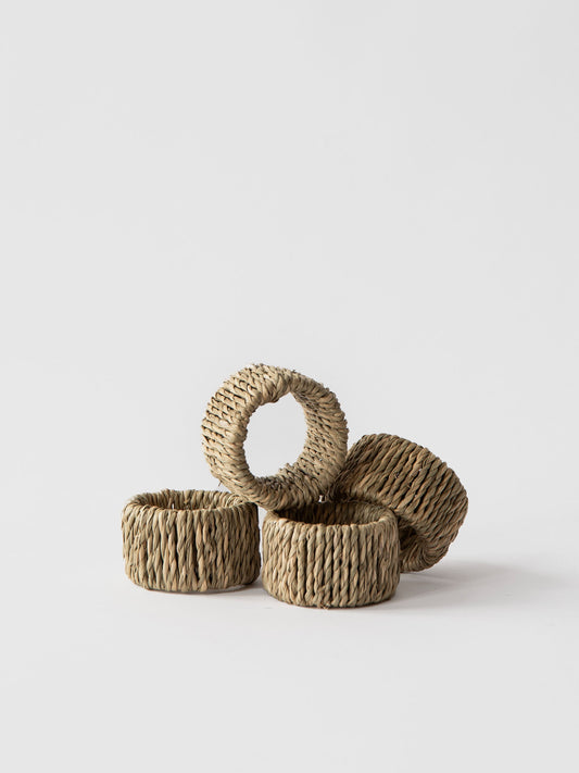 A set of four beige Nori napkin rings made from seaweed, displayed against a white background.