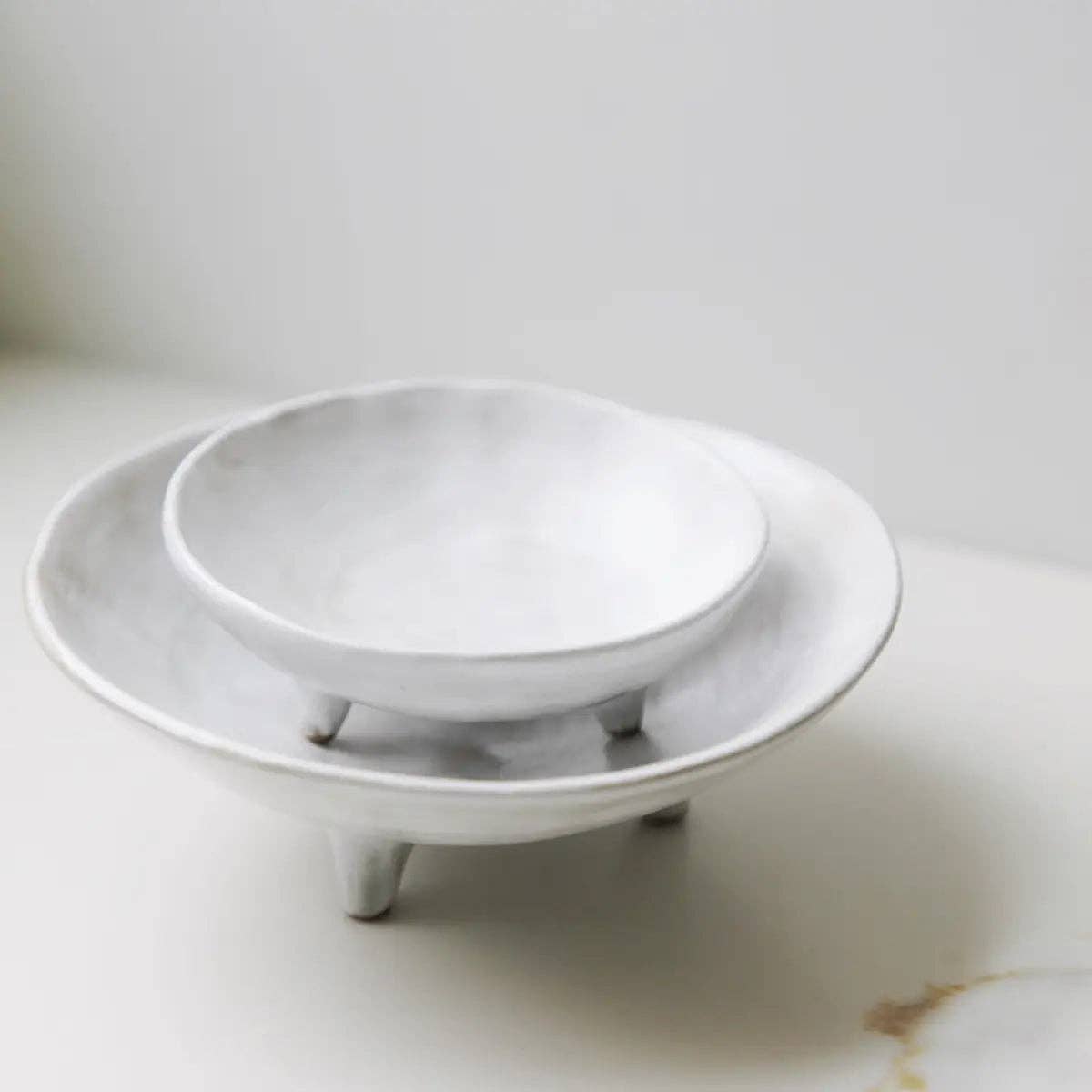 footed ceramic display bowl