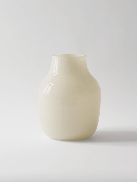 White ceramic vase on a light gray background